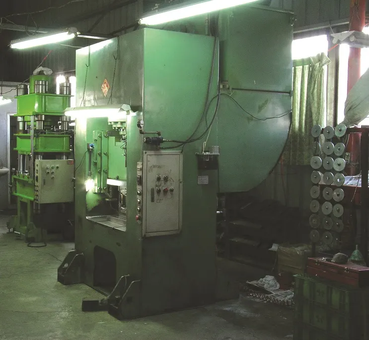 Stamping press on the production floor used for forging and forming tool blanks
